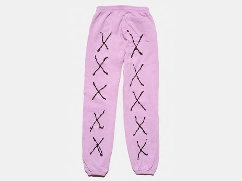 100 % cotton lavender sweat pants. Four painted, drippy black X's run down each leg. The composition continues on the other side of the pants.